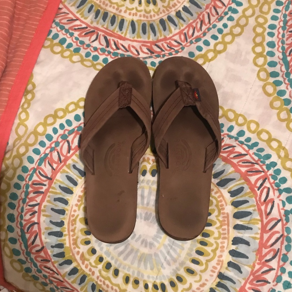 Rainbow leather flip flops.